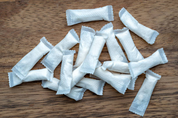 Box of swedish nicotine , snus on wood background